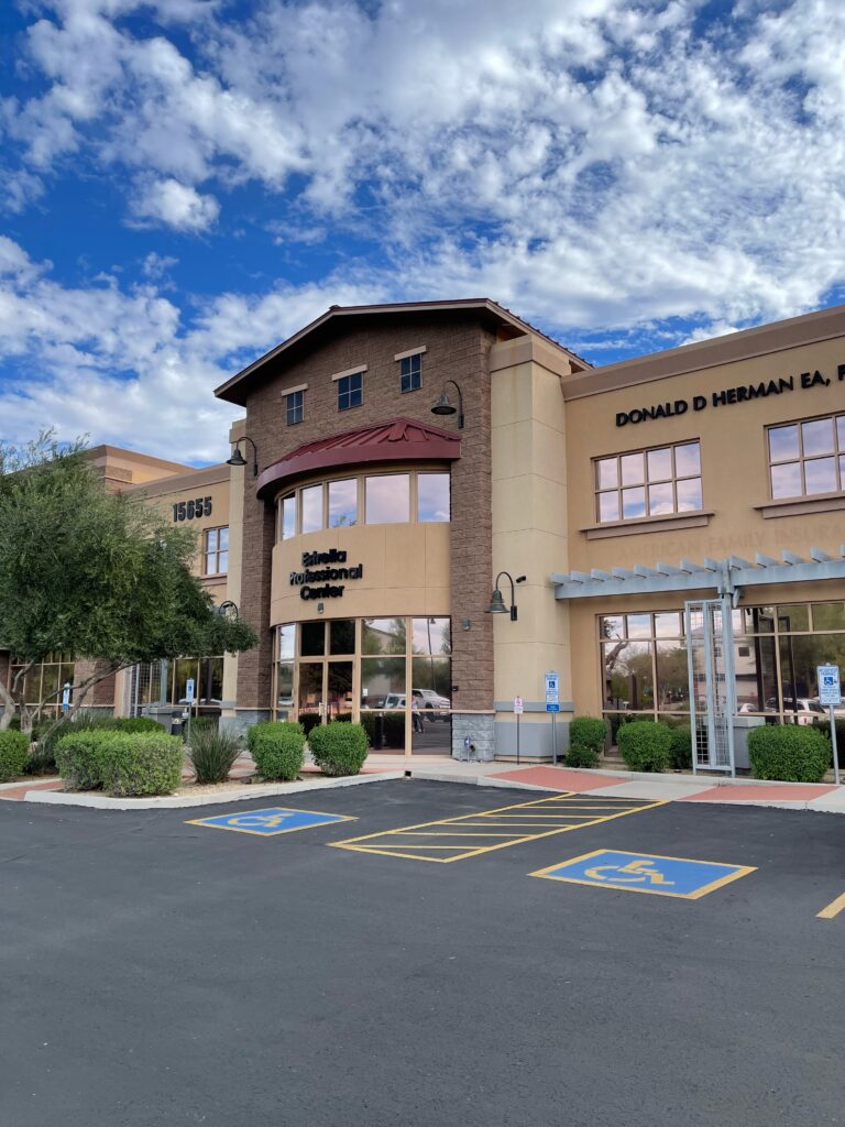 A building with many windows and doors on the outside.